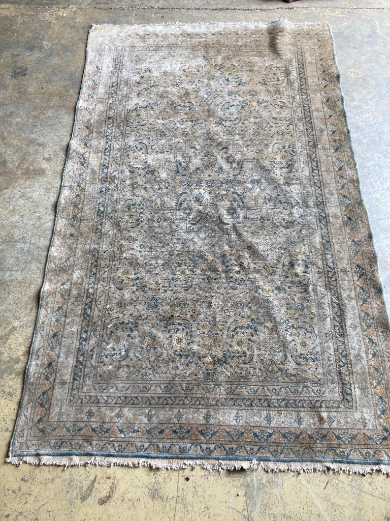 Four worn Persian rugs, largest 190 x 133cm